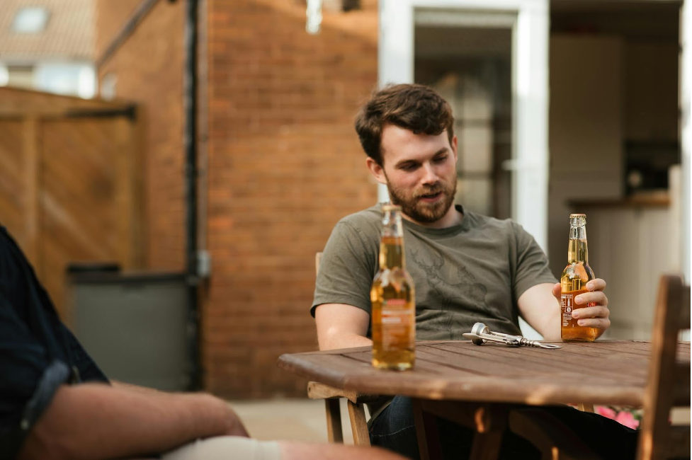 man holding beer